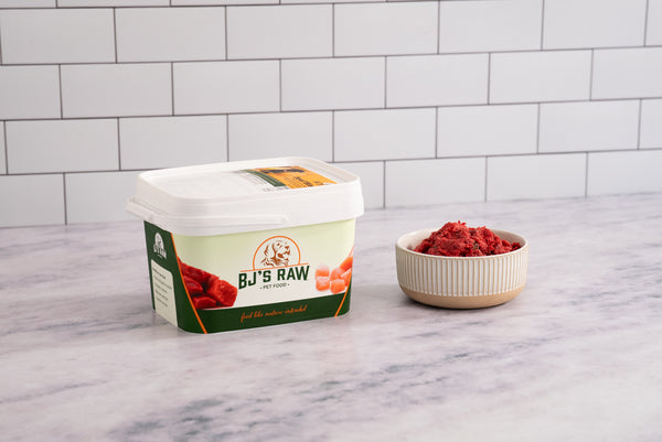 BJ's Beef Blend raw dog food in container with fresh ground beef