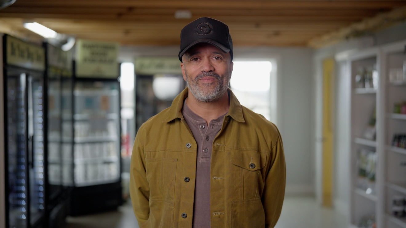 Author Carlos Whittaker on the BJ's Raw Pet Food farm in Lancaster, Pennsylvania, with farm-fresh raw dog food blends, showcasing his transition to a raw diet for his Bernese Mountain Dogs.